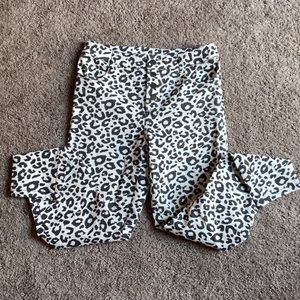 Cheetah Patterned pants in skinny/straight leg style. Four accent buttons